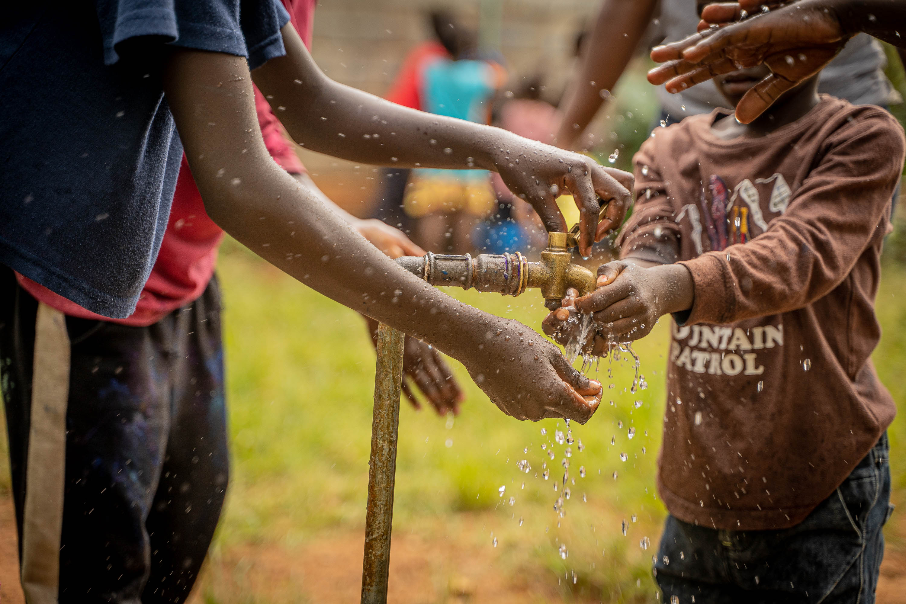 successful well built in Sauti Kuu Kenya where children wash their hands